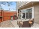 Relaxing outdoor patio with a grill, outdoor seating, and privacy fence perfect for entertaining at 7476 E Arkansas Ave # 35-01, Denver, CO 80231