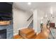 Stairway features hardwood steps and blue carpeting, leading to the upper level of the home at 7476 E Arkansas Ave # 35-01, Denver, CO 80231