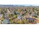 A bird's eye view of the house nestled among a neighborhood and mountain view at 10234 W Geddes Cir, Littleton, CO 80127