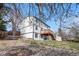 Exterior view of two-story home from the backyard showing spacious back deck and landscaping at 10234 W Geddes Cir, Littleton, CO 80127
