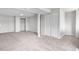 Finished basement with neutral carpet and paint, closet and ample space for comfortable living at 10234 W Geddes Cir, Littleton, CO 80127
