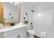Neutral bathroom with a combined shower and tub featuring a new vanity at 10234 W Geddes Cir, Littleton, CO 80127