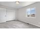 This empty bedroom features plush carpeting and a large window for natural light at 10234 W Geddes Cir, Littleton, CO 80127