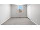 Bright bedroom features soft carpeting, fresh neutral paint, window and double door closet at 10234 W Geddes Cir, Littleton, CO 80127