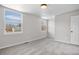 This bedroom has plush carpeting and a large window allowing for natural light at 10234 W Geddes Cir, Littleton, CO 80127