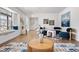 Spacious living area with hardwood floors, a window seat, and stylish furniture at 10234 W Geddes Cir, Littleton, CO 80127