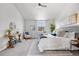 This primary bedroom features stylish decor, neutral colors, a ceiling fan, and plush carpet at 10234 W Geddes Cir, Littleton, CO 80127