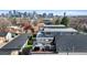Aerial view of rooftop deck featuring lounge and dining areas, offering panoramic city views at 3636 Lipan St, Denver, CO 80211