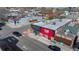 Aerial view of commercial buildings on a city street with cars and other businesses nearby at 3636 Lipan St, Denver, CO 80211
