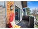 Cozy balcony with brick floors, modern lighting, and an open slider looking into the adjacent bedroom at 3636 Lipan St, Denver, CO 80211