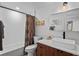 Bright bathroom featuring a modern vanity, textured tile shower, and stylish fixtures at 3636 Lipan St, Denver, CO 80211