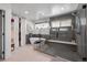 Luxurious bathroom featuring a walk-in shower, soaking tub, and a walk-in closet at 3636 Lipan St, Denver, CO 80211