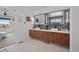 Bathroom features a dual sink vanity with walnut cabinets and modern fixtures, plus stylish mosaic backsplash at 3636 Lipan St, Denver, CO 80211