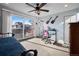 Bedroom with city views, ceiling fan, and a dedicated desk space for study or work at 3636 Lipan St, Denver, CO 80211