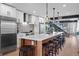Stylish kitchen with a center island, stainless steel appliances, modern lighting, and barstool seating at 3636 Lipan St, Denver, CO 80211