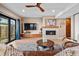 Cozy living room with a fireplace, flat-screen TV, and a sliding door for natural lighting at 3636 Lipan St, Denver, CO 80211