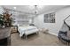 Serene main bedroom with birch-themed wallpaper, chandelier, and a cozy hammock for relaxation at 3636 Lipan St, Denver, CO 80211