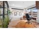 Bright office with a light wood floor, natural lighting, black metal window trim, and a brown hide rug at 3636 Lipan St, Denver, CO 80211