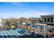 Relaxing rooftop deck with outdoor seating and stunning views of the city skyline at 3636 Lipan St, Denver, CO 80211