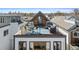 Aerial view of a rooftop deck featuring an outdoor dining area and comfortable lounge seating at 3636 Lipan St, Denver, CO 80211