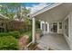 Outdoor deck space with sliding glass doors and access to a lush backyard with privacy fencing at 1900 S Gilpin St, Denver, CO 80210