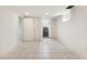 Basement offers an open floor plan, tile flooring, and access to the stairs and other rooms at 1900 S Gilpin St, Denver, CO 80210
