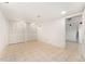 Finished basement featuring tile flooring, bright white walls, and closet storage at 1900 S Gilpin St, Denver, CO 80210