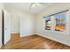 Comfortable bedroom features hardwood floors, neutral paint, and a closet at 1900 S Gilpin St, Denver, CO 80210