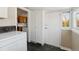 Convenient laundry room features a washer, dryer, and storage at 1900 S Gilpin St, Denver, CO 80210