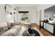 Bright living room featuring hardwood floors, neutral paint, and stylish decor at 1900 S Gilpin St, Denver, CO 80210