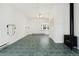 Large living room featuring a beamed ceiling, a fireplace, and tiled floors at 1900 S Gilpin St, Denver, CO 80210