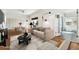Inviting living room with hardwood floors, neutral paint, and an open layout at 1900 S Gilpin St, Denver, CO 80210