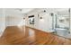 Spacious room features hardwood floors, neutral paint, and abundant natural light at 1900 S Gilpin St, Denver, CO 80210