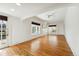 Large living room with hardwood floors, neutral paint, and bright natural light at 1900 S Gilpin St, Denver, CO 80210