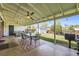Charming outdoor patio with string lights, dining area, and well-maintained yard at 1475 Lucille Ct, Northglenn, CO 80233