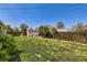 Spacious backyard featuring a well-manicured lawn, storage shed and privacy fence at 1475 Lucille Ct, Northglenn, CO 80233