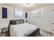 Comfortable bedroom with a queen-sized bed, neutral walls, and modern accents at 1475 Lucille Ct, Northglenn, CO 80233