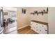 Dining area adjacent to the kitchen featuring hardwood floors, built-in storage and natural light at 1475 Lucille Ct, Northglenn, CO 80233
