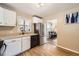 Functional kitchen with white cabinetry and stainless steel appliances, offering a practical cooking space at 1475 Lucille Ct, Northglenn, CO 80233