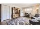 Cozy living area featuring hardwood floors and an attractive rug, bathed in natural light from the windows at 1475 Lucille Ct, Northglenn, CO 80233