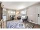 Bright and spacious living room with hardwood flooring and natural light, ideal for relaxing and entertaining at 1475 Lucille Ct, Northglenn, CO 80233