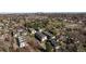 A charming neighborhood nestled among lush greenery with a clear view of the city skyline in the distance at 5880 W 39Th Pl, Wheat Ridge, CO 80212