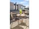 Outdoor seating area with table and chairs against modern architecture, creating a cozy and inviting space at 5880 W 39Th Pl, Wheat Ridge, CO 80212