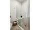 Modern bathroom featuring a glass-enclosed shower with bench seating at 5880 W 39Th Pl, Wheat Ridge, CO 80212