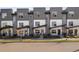 Contemporary townhome exterior with modern design, landscaping, and inviting curb appeal at 5880 W 39Th Pl, Wheat Ridge, CO 80212
