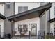 Cozy front porch with seating area, perfect for enjoying the outdoors and welcoming guests at 5880 W 39Th Pl, Wheat Ridge, CO 80212