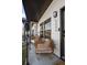 Charming front porch featuring cozy wicker seating, perfect for relaxing and enjoying the neighborhood views at 5880 W 39Th Pl, Wheat Ridge, CO 80212