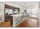 Modern kitchen with stainless steel appliances, a spacious island with seating, and sleek countertops at 5880 W 39Th Pl, Wheat Ridge, CO 80212