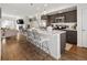 Bright kitchen with a large island, pendant lighting, stainless appliances, and an open layout at 5880 W 39Th Pl, Wheat Ridge, CO 80212