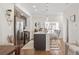 Contemporary kitchen with stainless steel appliances, white countertops, and stylish bar seating for a modern look at 5880 W 39Th Pl, Wheat Ridge, CO 80212